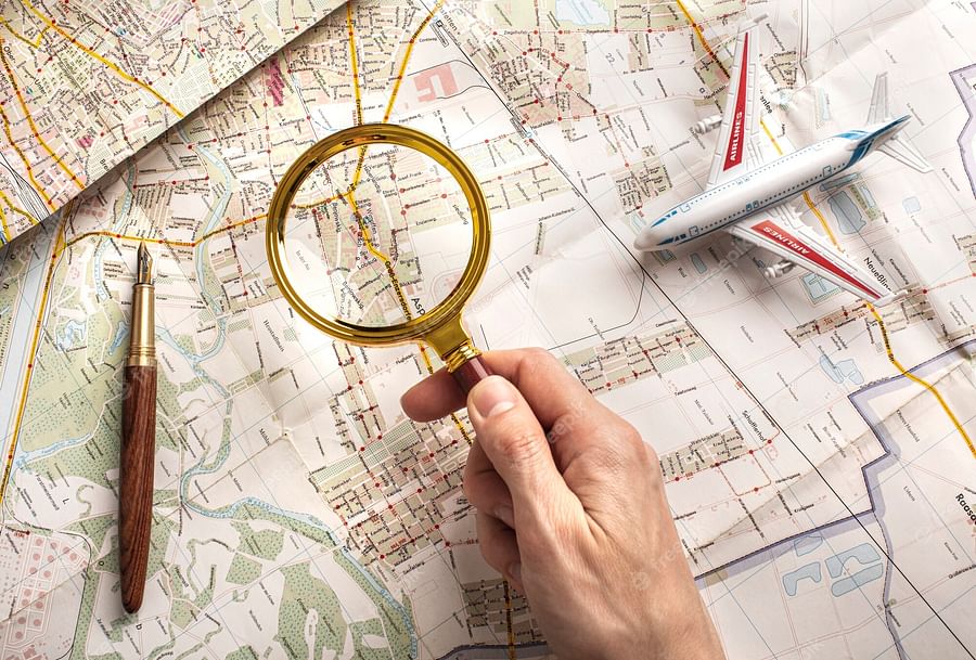 Hand drawn map with magnifying glass highlighting a specific area, symbolizing the search for a local herbalist