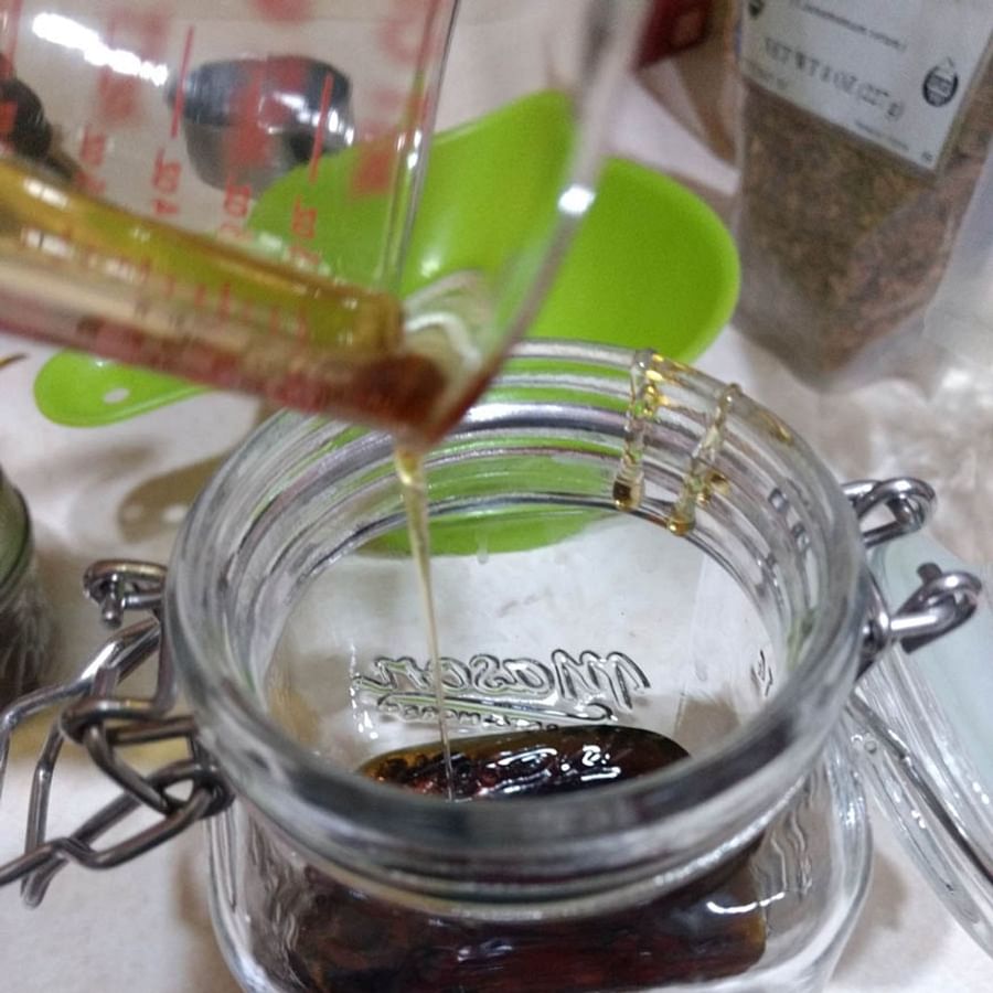 Ancient illustration of people preparing Oxymel